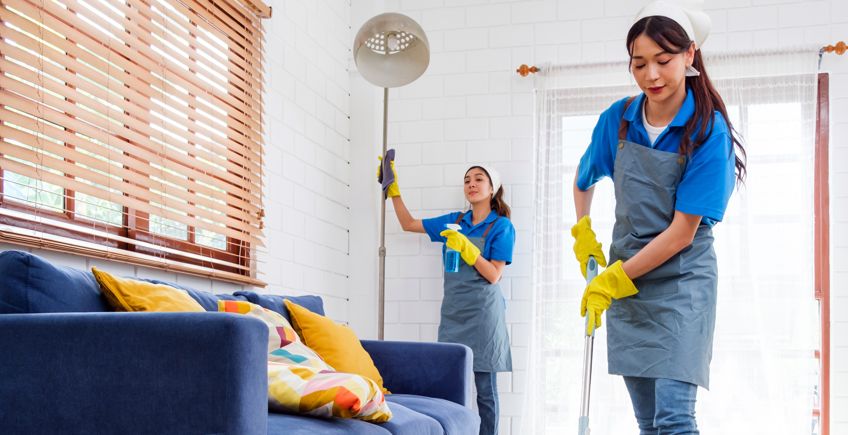 Professional cleaner dusting ceiling fan